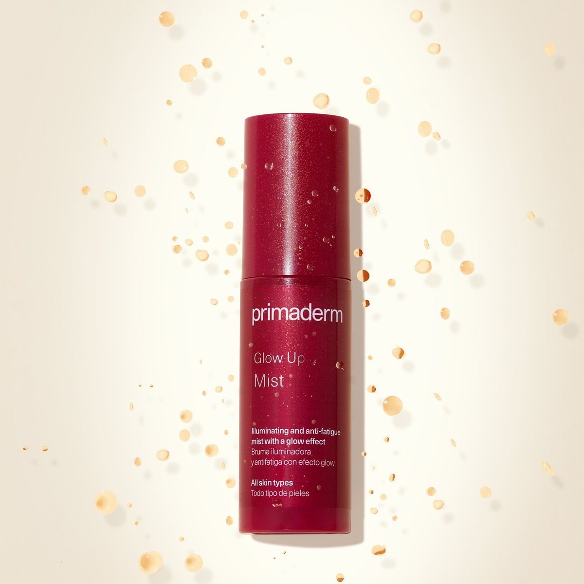 Glow Up Mist bottle surrounded by golden soft-focus particles