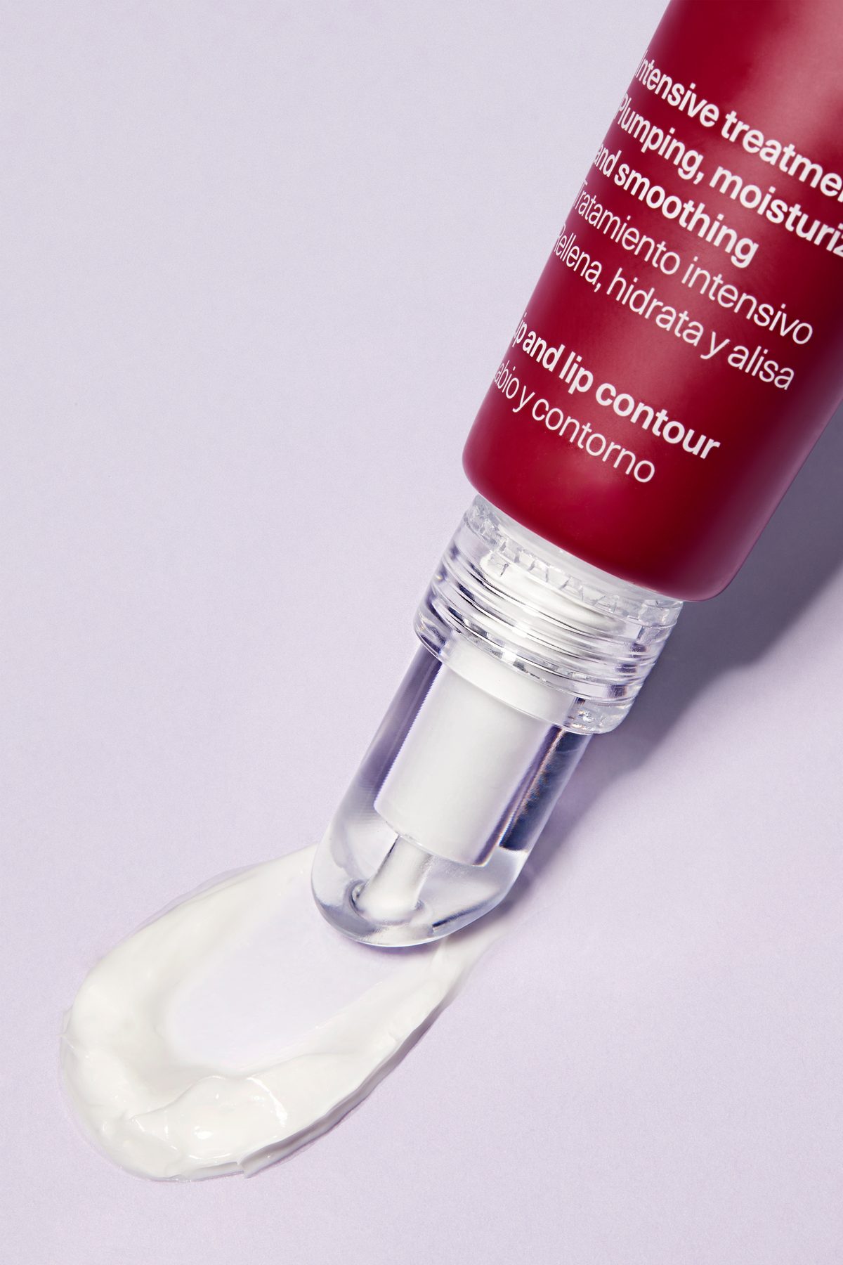 The Booster Peptide Balm applicator tip with a trail of glossy balm