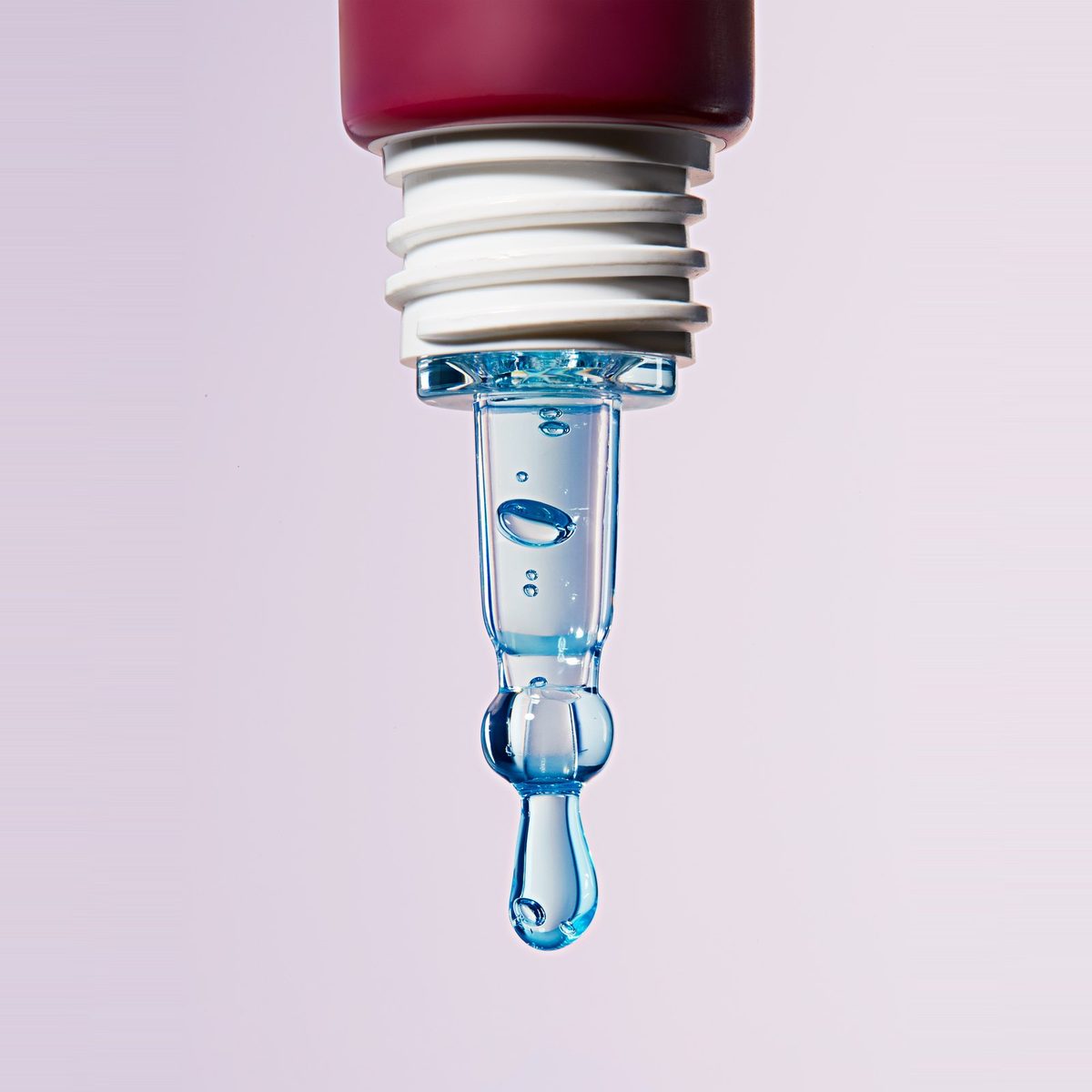 Close-up of the Contour Eye Gel cool-tip applicator with blue beads