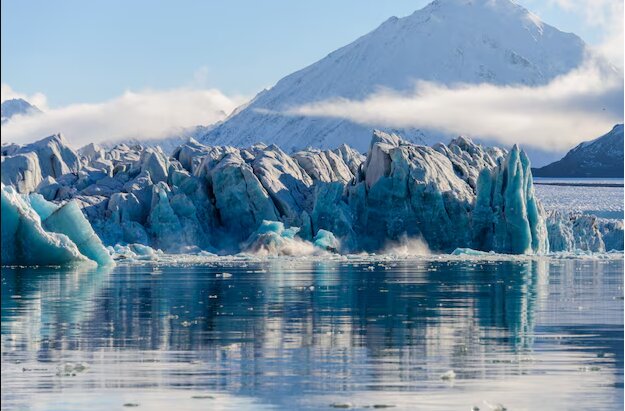 Icy blue glacier meeting the sea